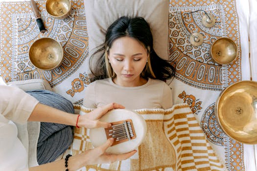 A serene meditation scene featuring a woman with kalimba and singing bowls, promoting relaxation and well-being.